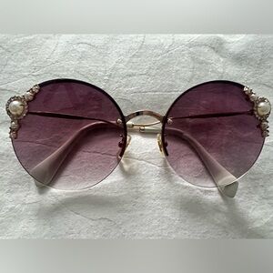 Elegant Miu Miu's Manière Sunglasses with pearl
Embellishments